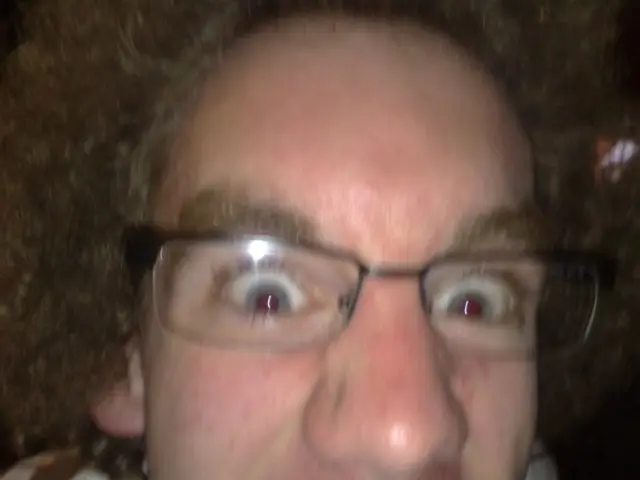 David Beckham and his son Romeo sport identical hairstyles and sunglasses, underscoring striking...