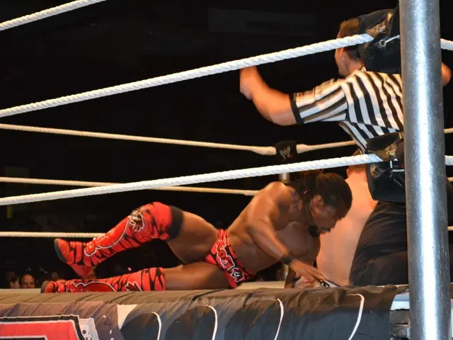 In this picture there is a man who is wearing red shirt and shoes. Beside him there is another man...