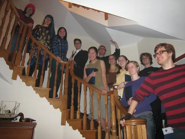 In this image we can see men and women are standing on the stairs and wooden railing is present in...
