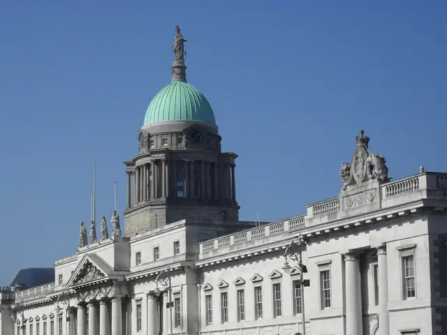 In this image, it looks like a museum and there is some statue on top of this museum and background...