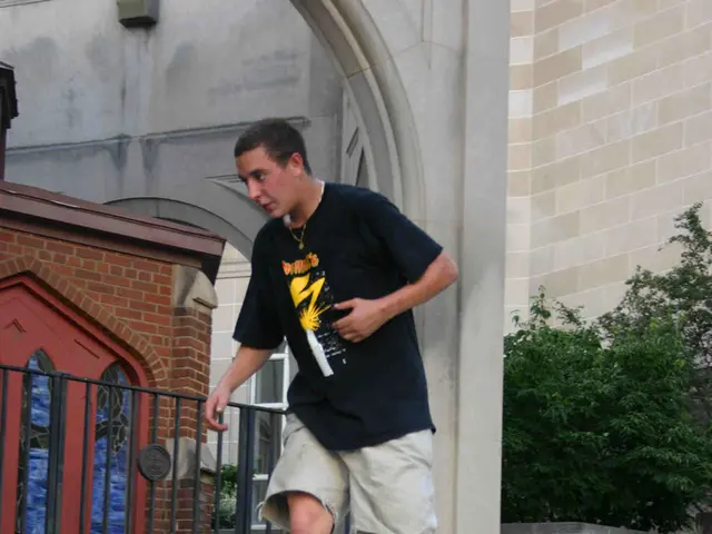 In this image, we can see a man is skating a skateboard on the wall. At the bottom, we can see...