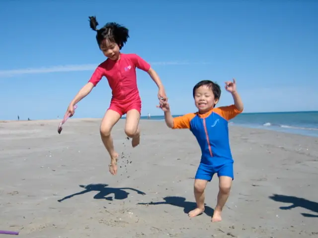 In this image we can see two children are playing holding their hands with one object in one of...
